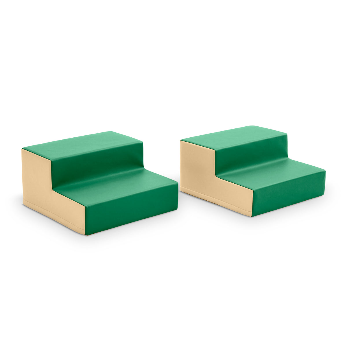 Two green and beige foam climbing blocks with stepped surfaces and connecting slots.
