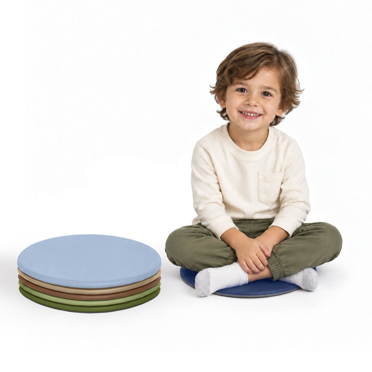 Six stacked round cushioned floor pads in blue, beige, rust, green, and dark blue colors.