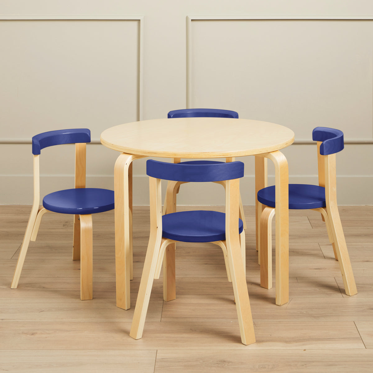 Bentwood table set with round cream top and four chairs with blue seats and curved wooden frames.