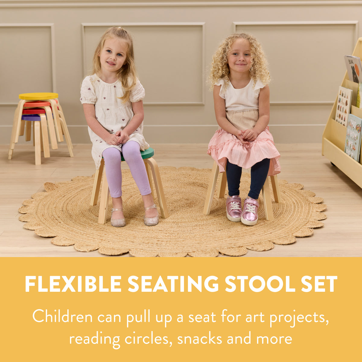 Two children seated on bentwood stools with natural wood frames and colored seats stacked in background.