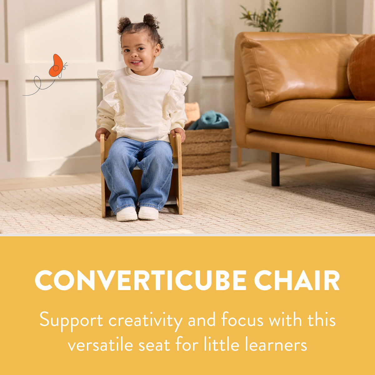 Toddler sitting in a wooden bentwood chair with natural finish and woven seat.