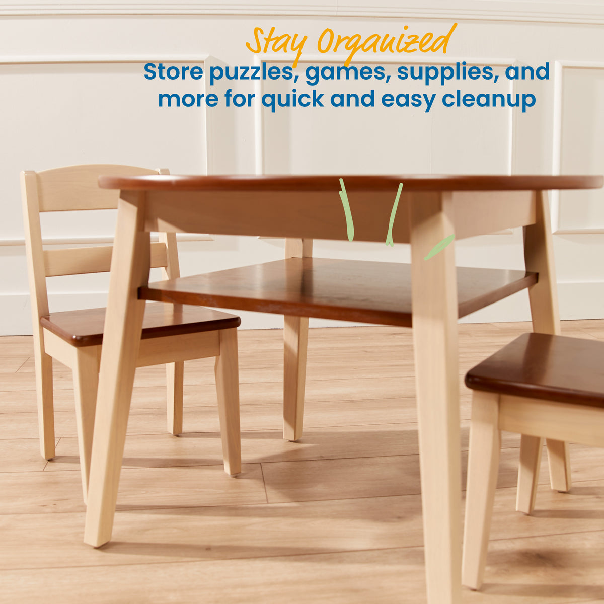 Light wood table with storage shelf and two matching chairs with dark seats on wooden floor.