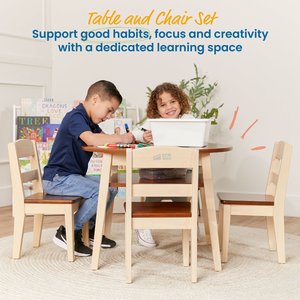 Natural wood children's table with two matching chairs and built-in storage shelves, two children seated at table.